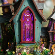 Violet stained-glass window detail of The Crooked Cauldron