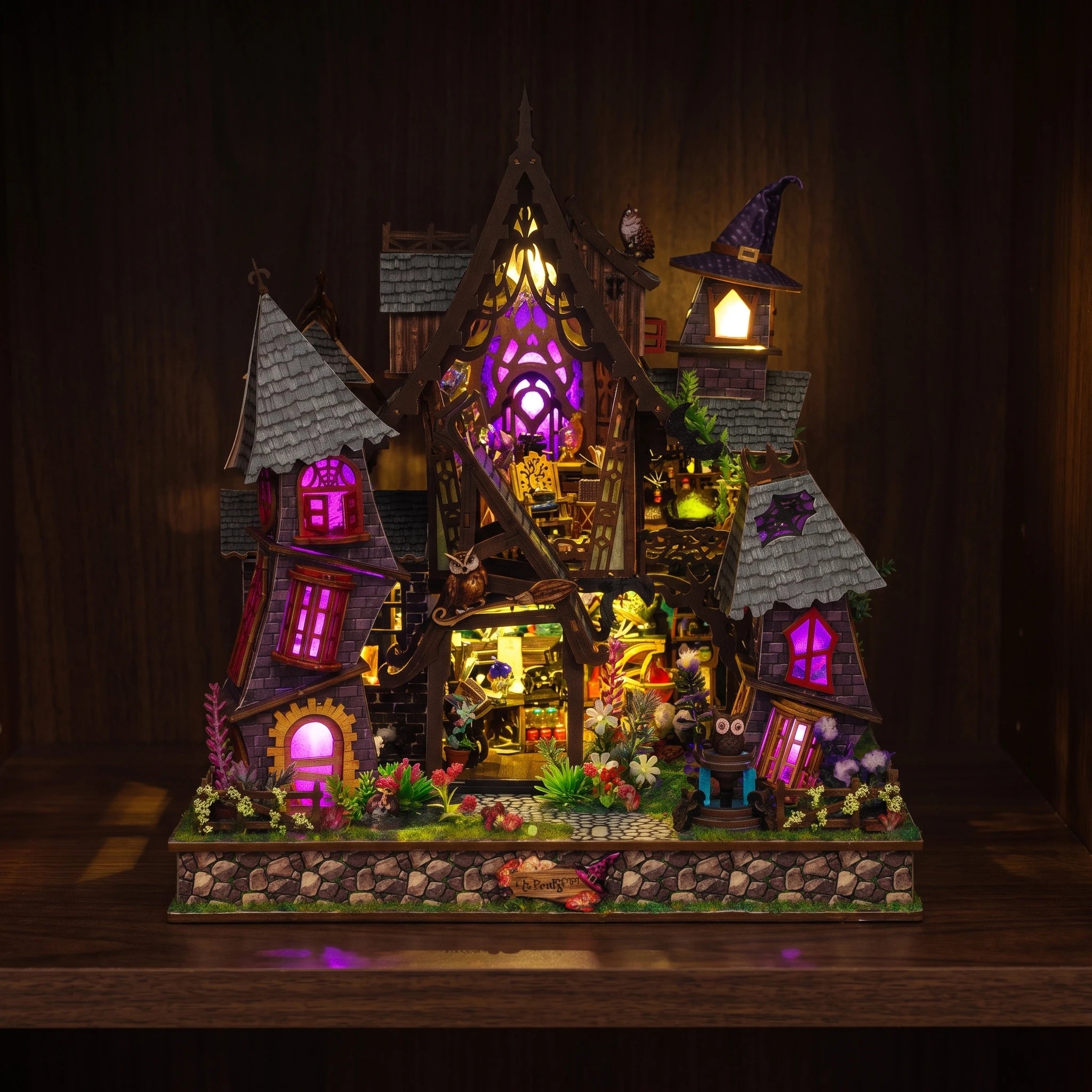The Crooked Cauldron glowing violet on a walnut shelf at night