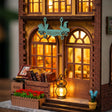 Macro of the WELCOME sign and book crate at The Crystal Quill's door