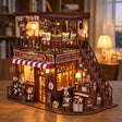 The Dessert House lit at dusk in a cozy living room