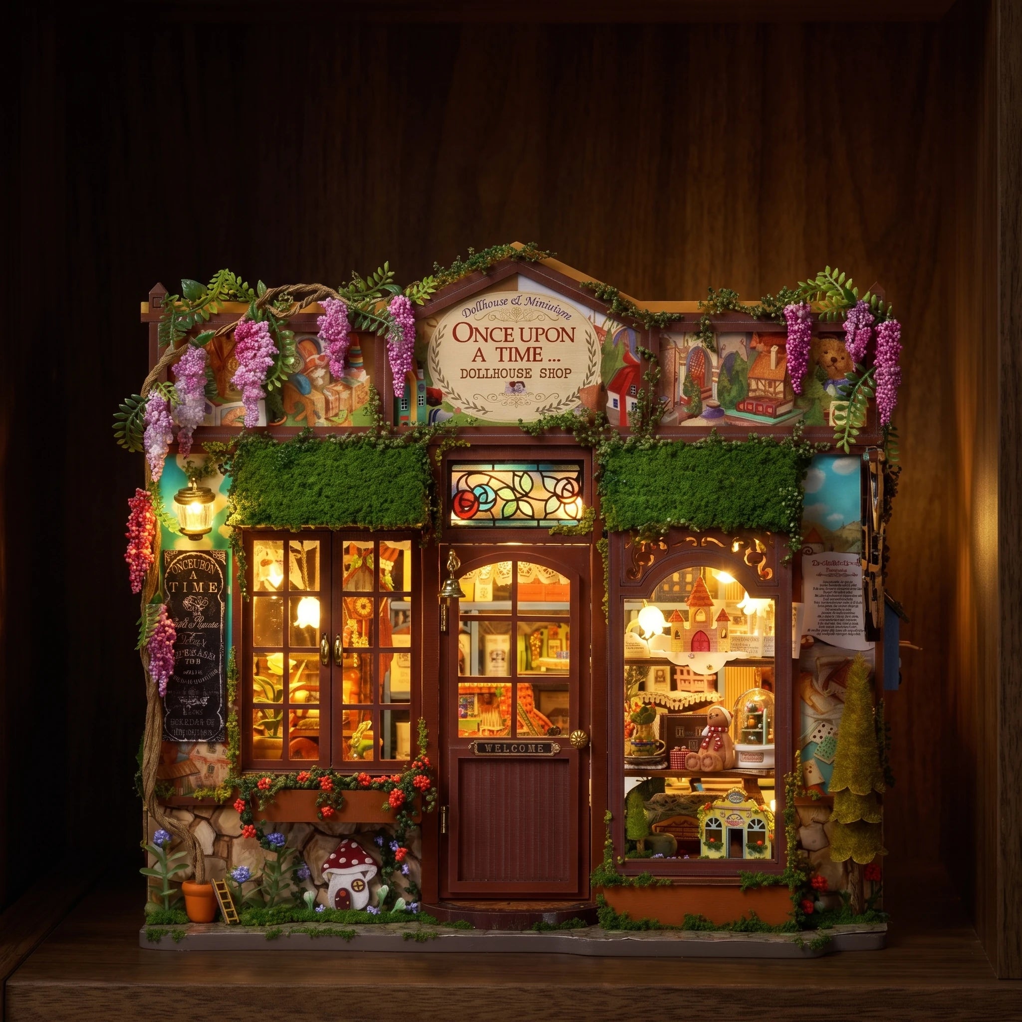 The Dollhouse Shop glowing on a dark walnut shelf at night