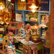 Detail of the gold carousel and rabbit shopkeeper inside The Dollhouse Shop