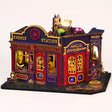 The Elixir Station DIY miniature magic shop kit with LED lights on, on a pale blush background