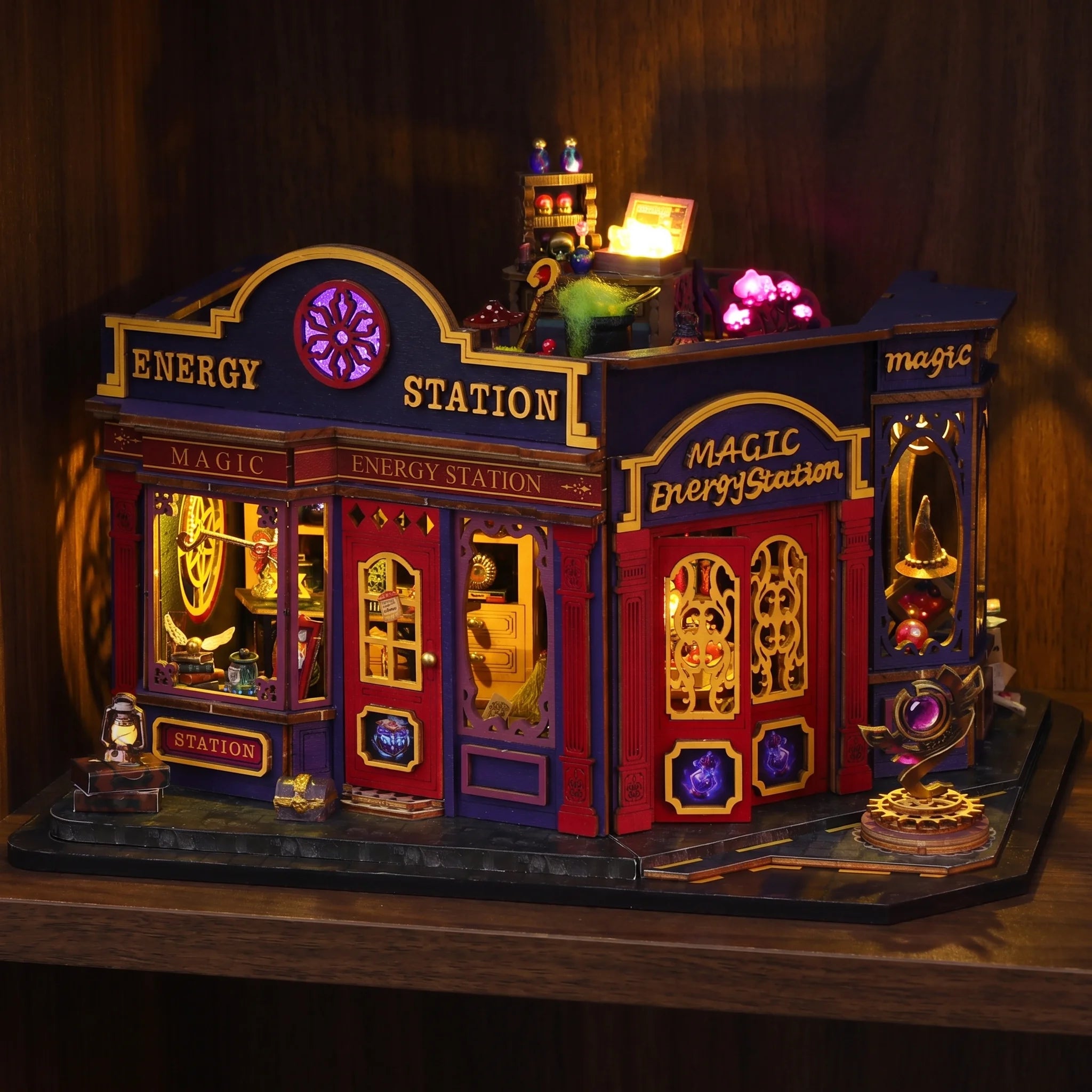 The Elixir Station miniature magic shop glowing on a dark walnut shelf at night
