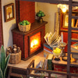 Macro of The Ember Loft fireside reading corner with glowing hearth