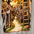 Detail of the winding path and wooden cart inside The Emerald Road