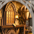 Detail of the arched castle window and lantern inside The Emerald Road