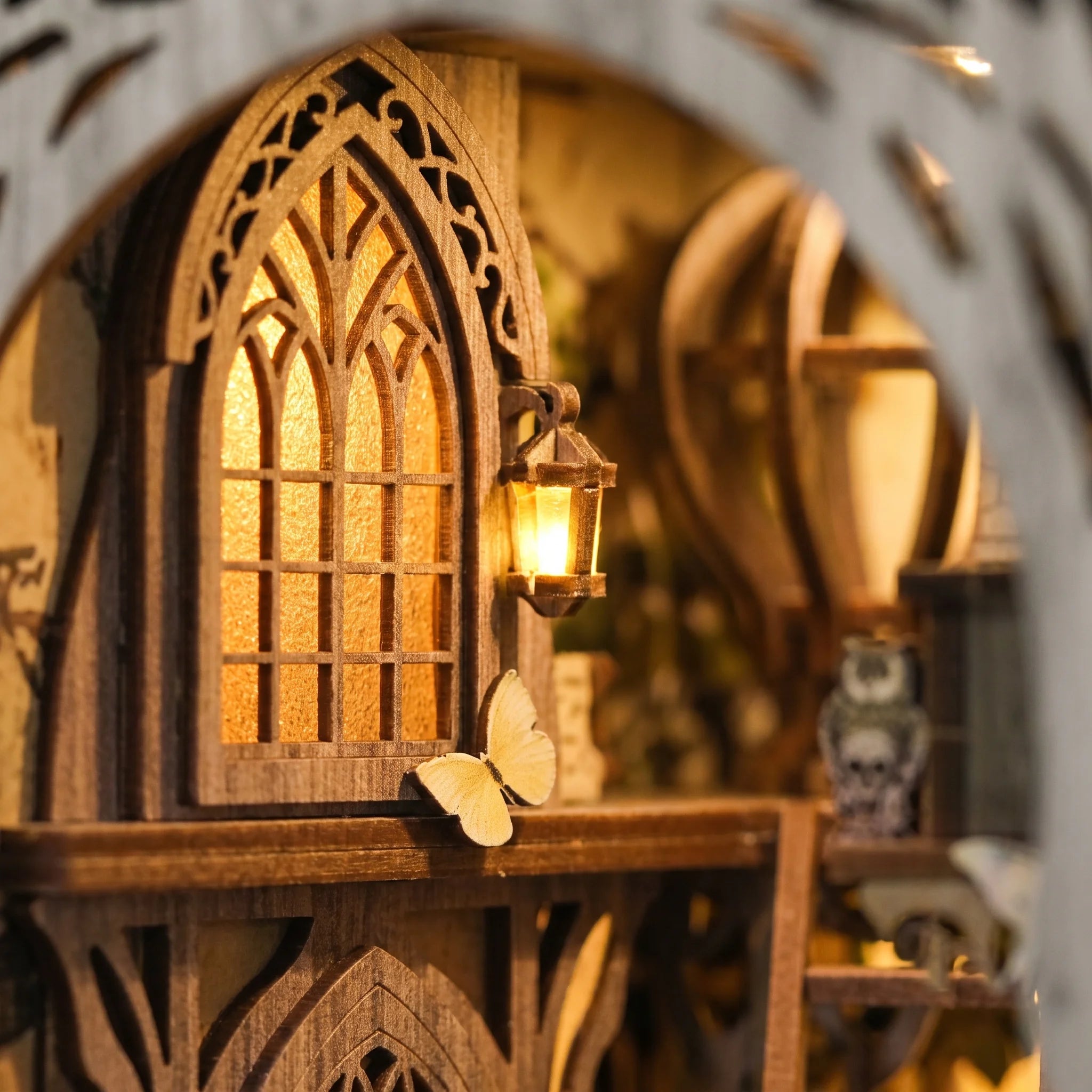 Detail of the arched castle window and lantern inside The Emerald Road