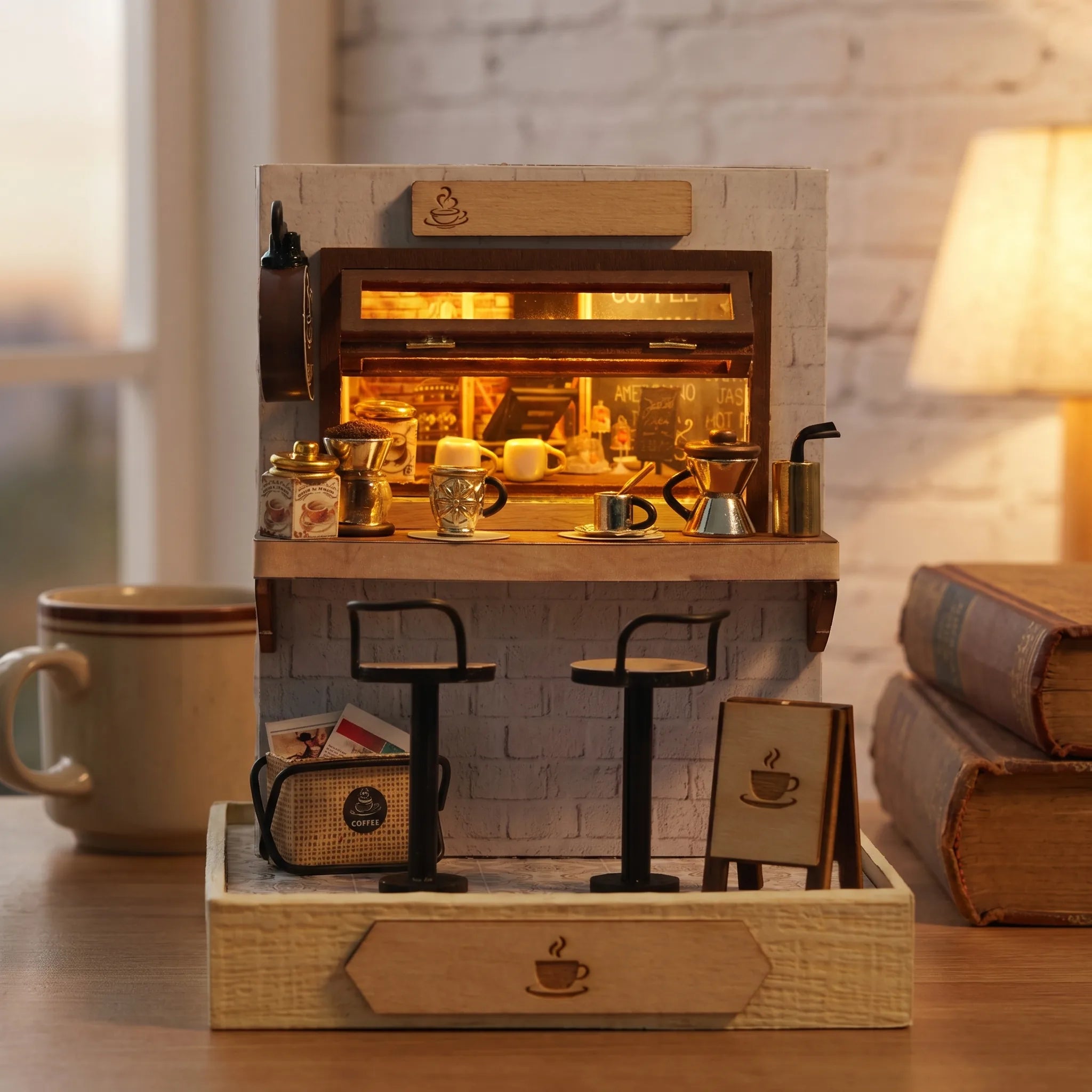 The Espresso Bar on a wood desk with a coffee mug and books at dusk
