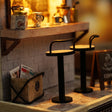 Close-up of the two bar stools at the brick counter