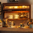 Close-up of the shelves of tiny cups and coffee-bean jars
