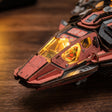 Macro of the amber cockpit canopy with the tiny pilot seat inside