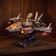The Explorer One glowing at night on a dark walnut shelf