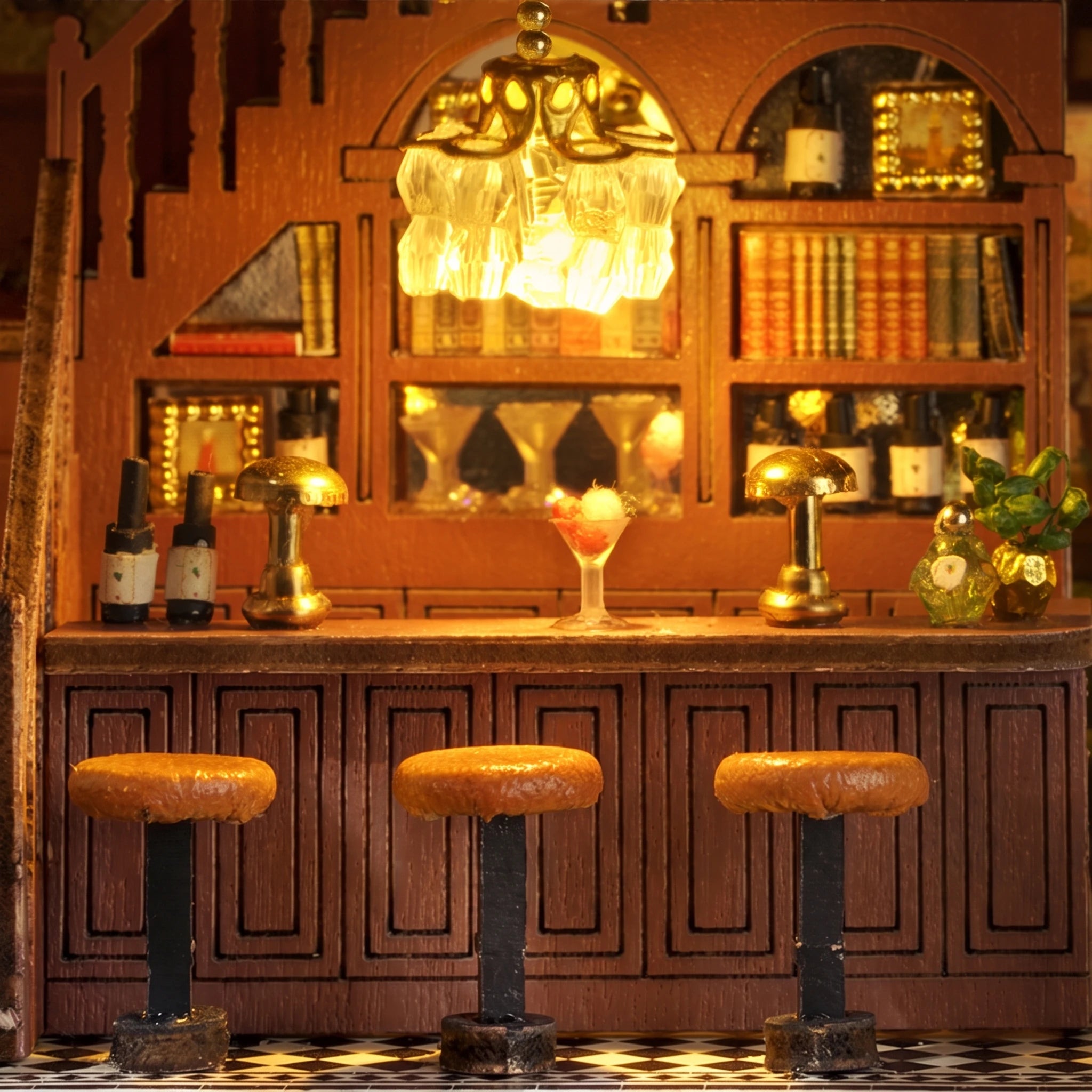Bar detail: round stools, tiny bottles and chandelier