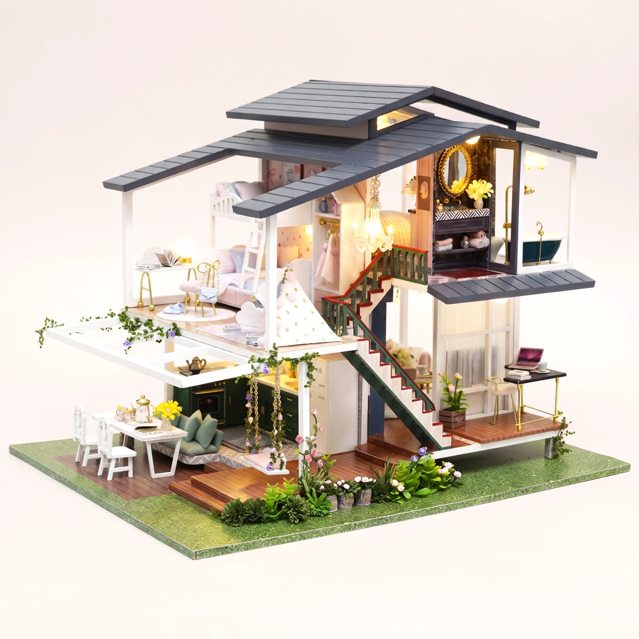 The Giverny Villa DIY miniature garden villa kit, LED lit, on a pale blush studio background