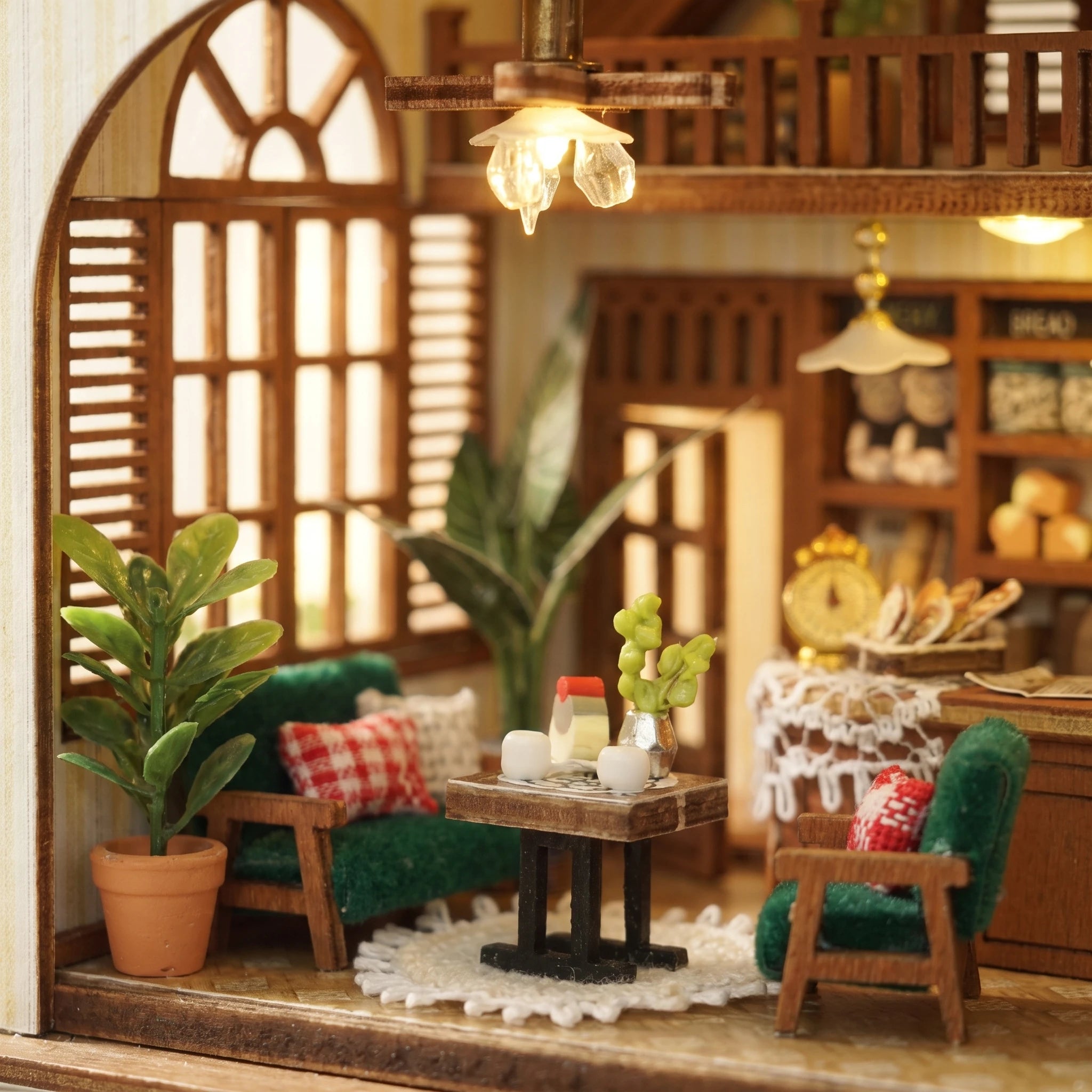 Window nook detail: green armchairs and gingham cushions
