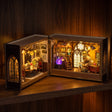 The Grimoire School glowing on a walnut shelf at night