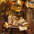 Study table detail: open spellbooks, scrolls and red chairs