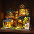 The Jade Courtyard glowing on a walnut shelf at night