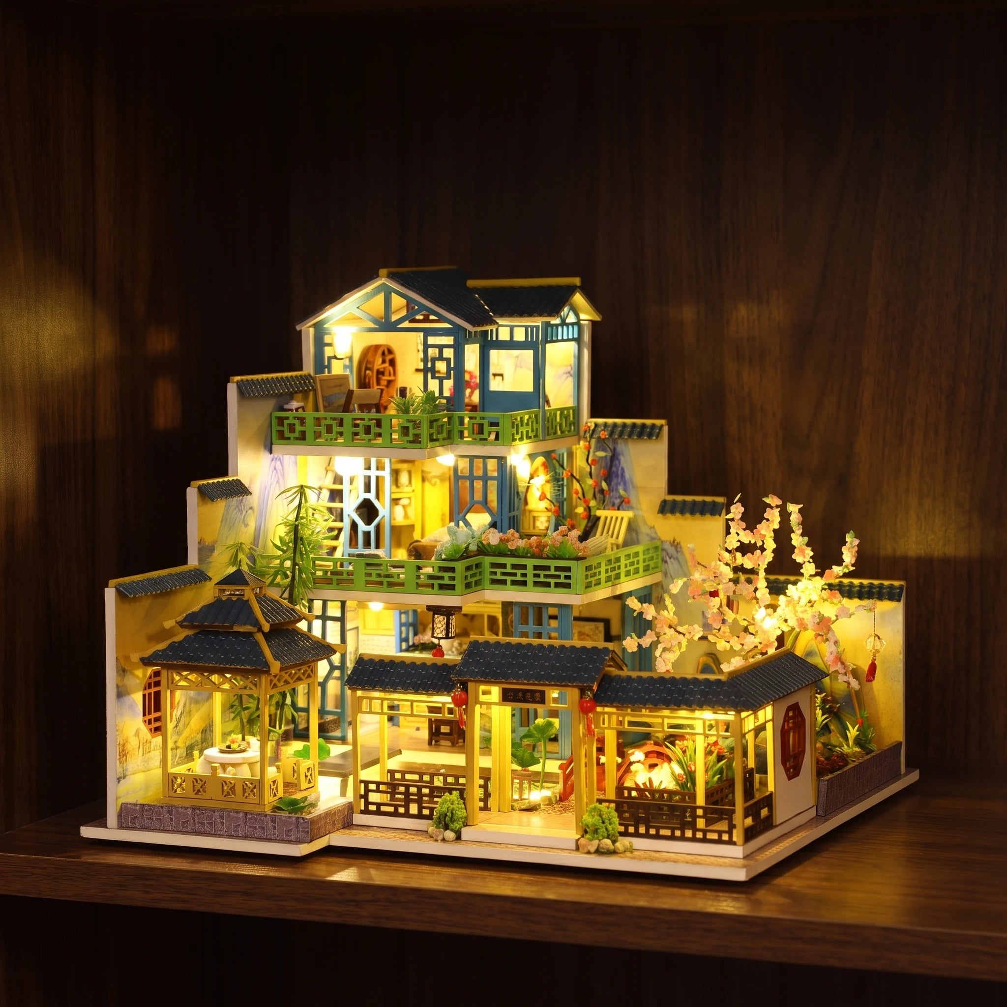 The Jade Terrace glowing on a walnut shelf at night
