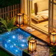 Macro of the glowing garden pond, slippers and stone path