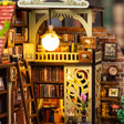 Book wall detail: globe lamp over shelves of tiny spines