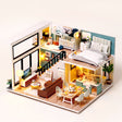 The Lullaby Loft DIY miniature family home kit, assembled with LED lights on