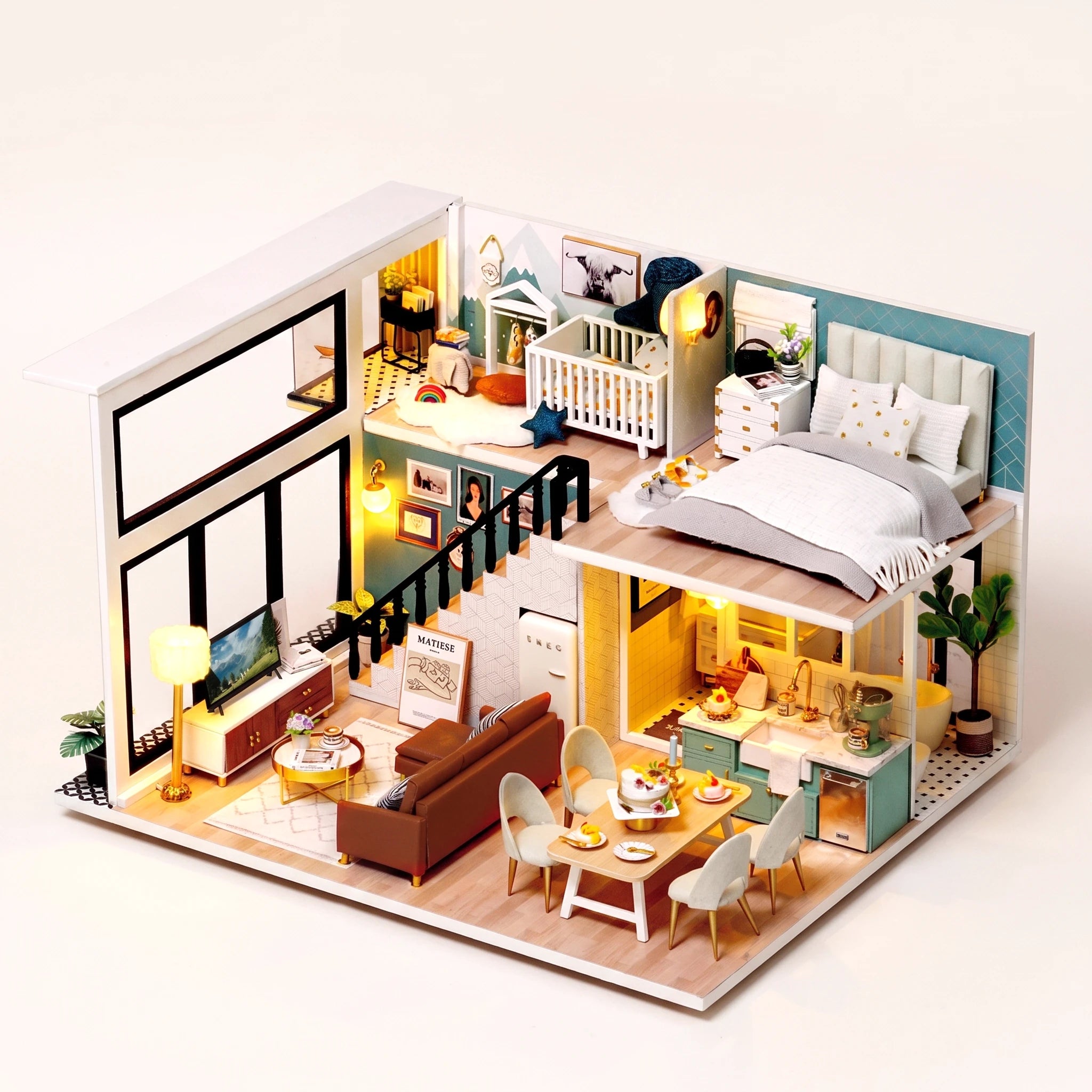 The Lullaby Loft DIY miniature family home kit, assembled with LED lights on