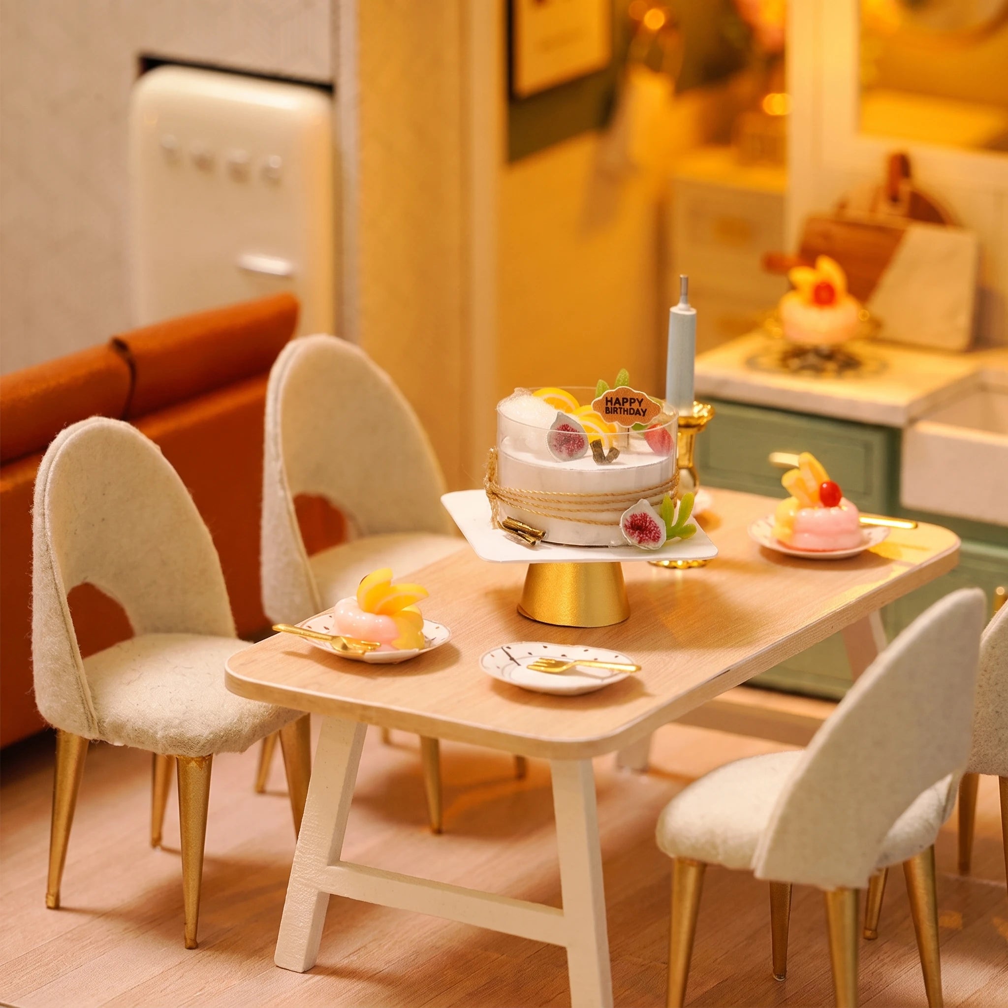 Dining detail: birthday cake on its gold stand