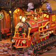 Close up of the red steam locomotive inside The Midnight Platform book nook