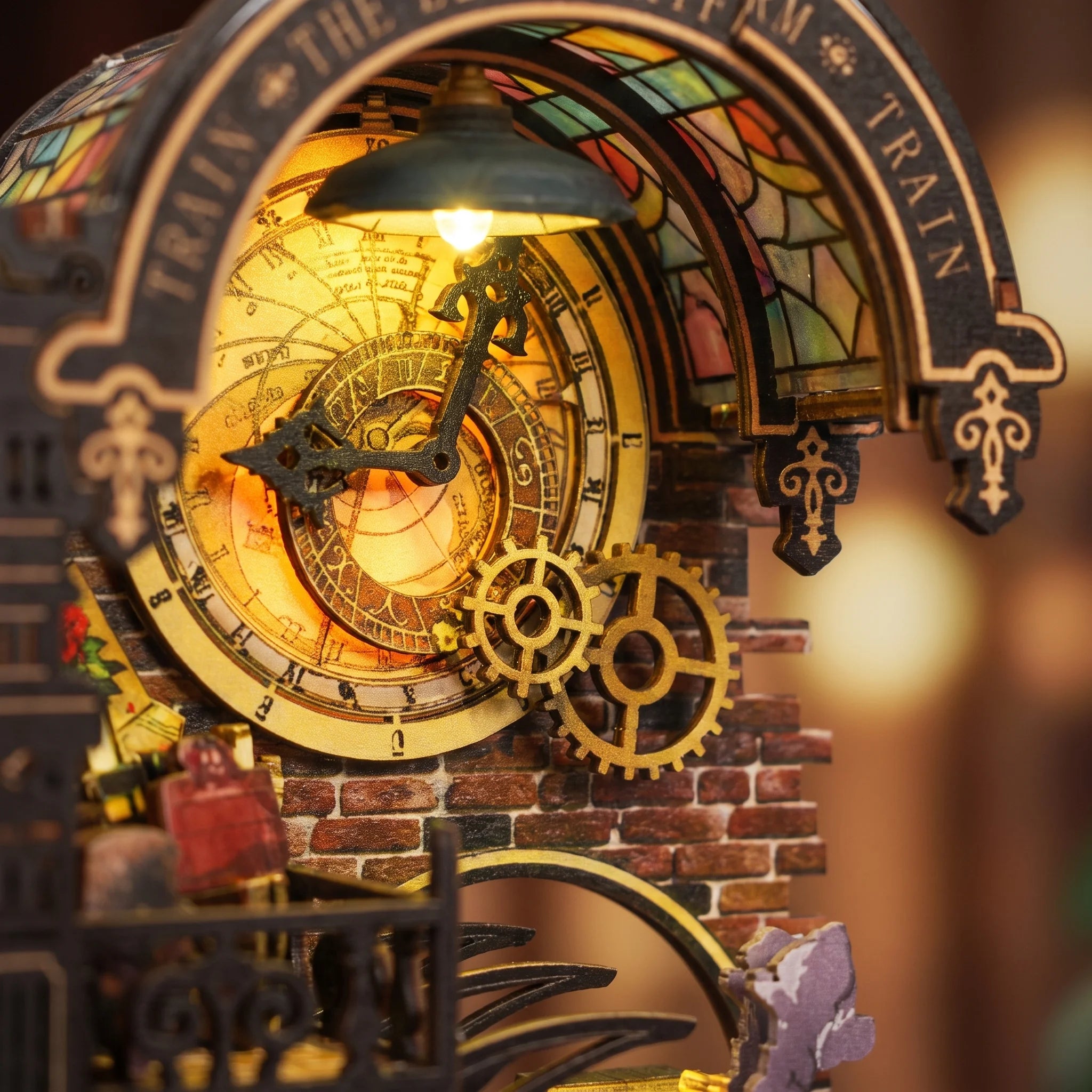 Close up of the glowing gold station clock and gears of The Midnight Platform