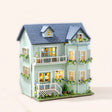 The Mint Gables DIY miniature house kit, assembled with LED lights on