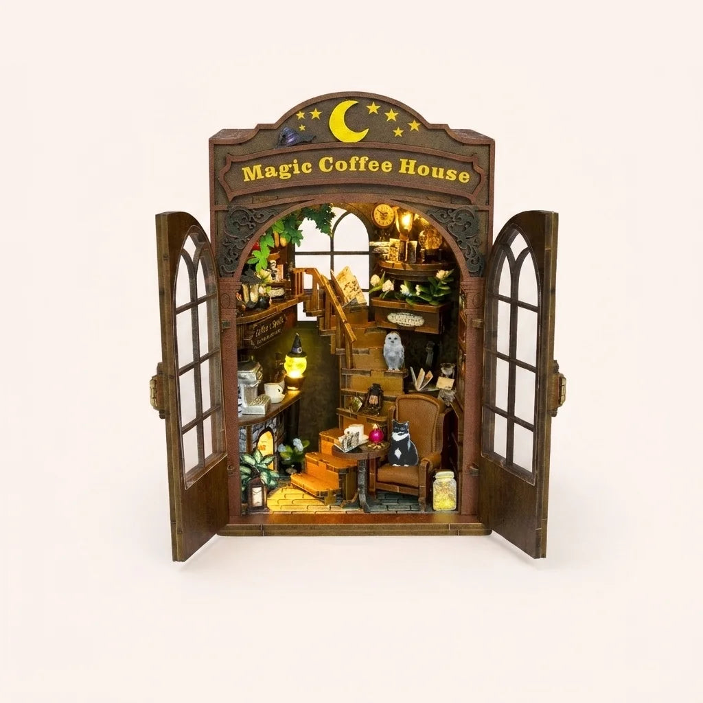 The Moonlit Brew DIY book nook kit, fully assembled with LED lights on