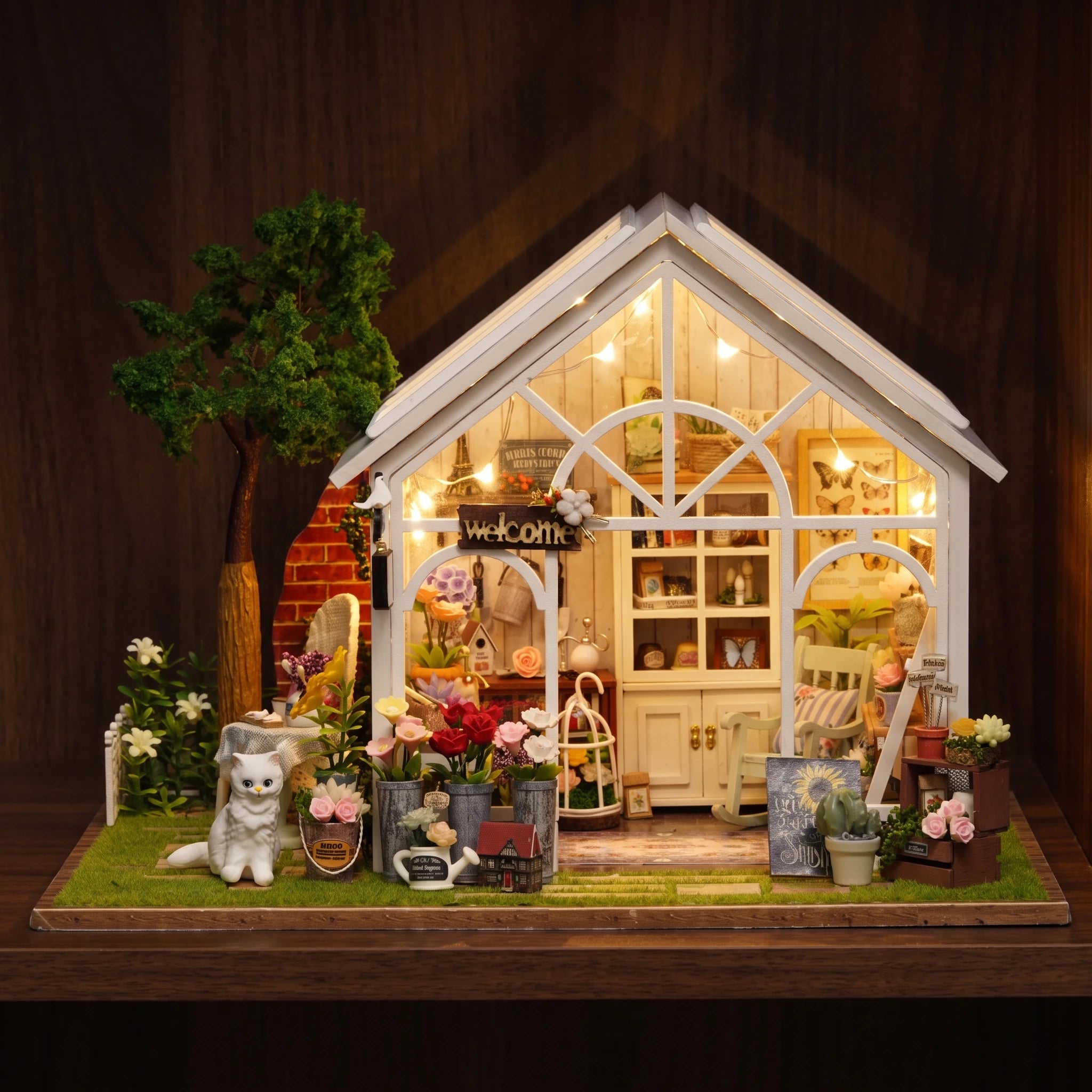 The Morning Greenhouse glowing on a dark walnut shelf at night