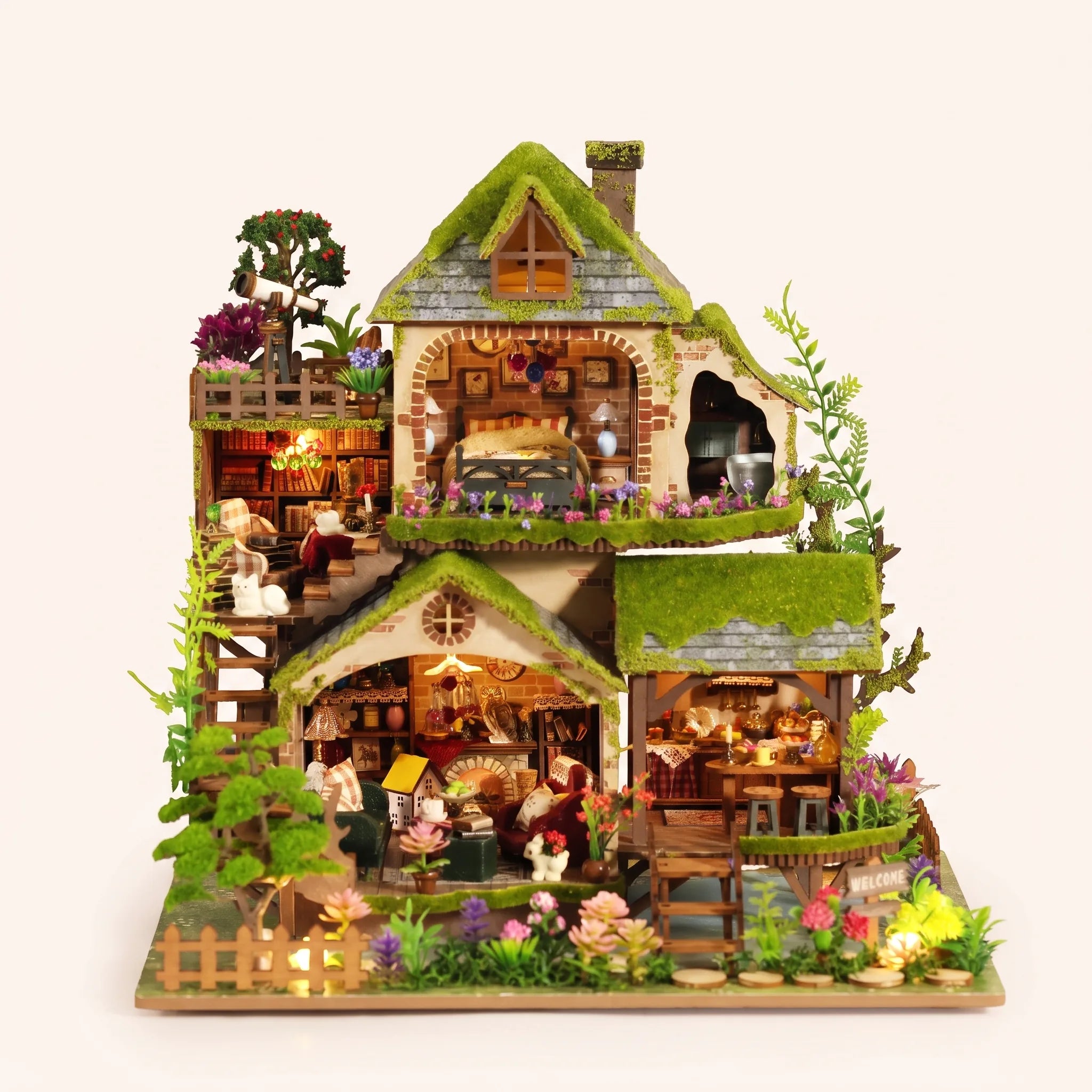 The Mossgrove Cottage DIY miniature kit with LED lights on, studio hero shot