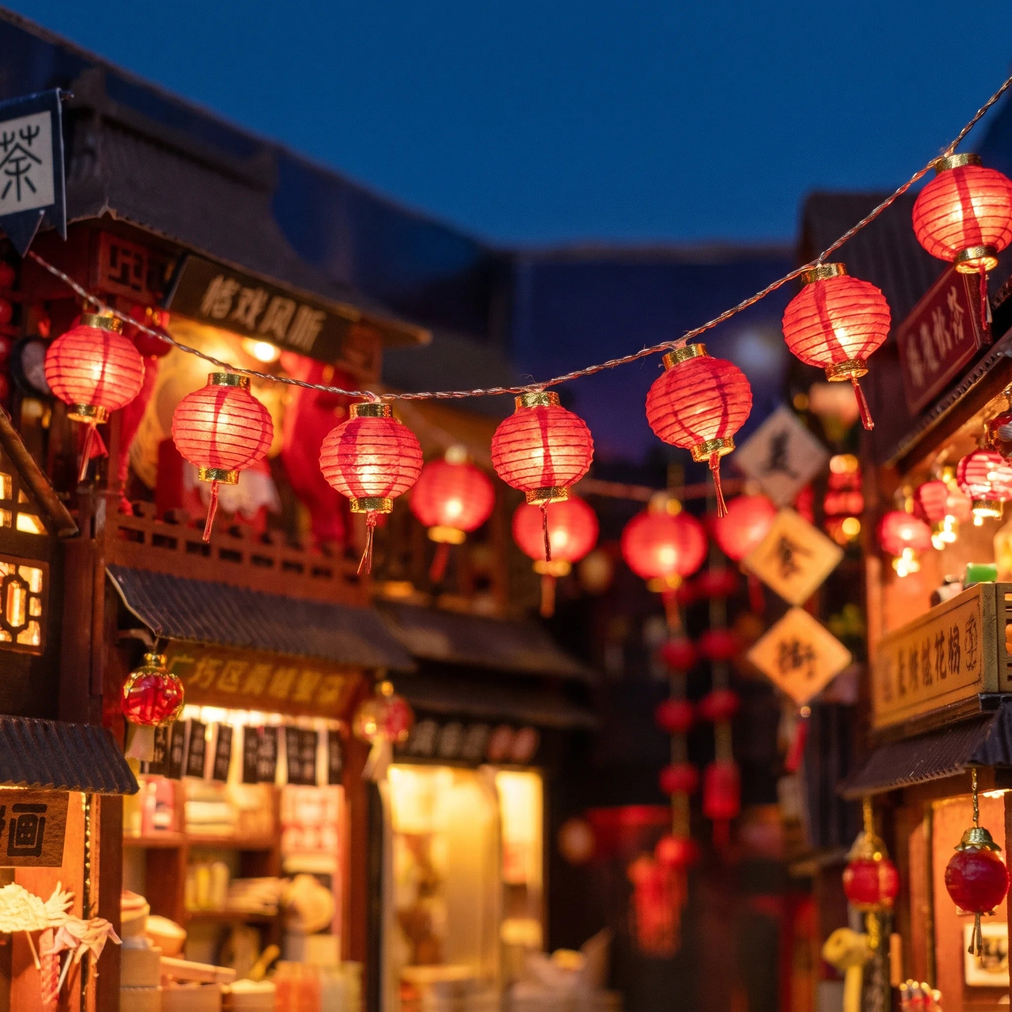 Detail of the red paper lantern strings inside The Night Market