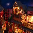 Detail of the tiled rooflines and moonlit sky inside The Night Market
