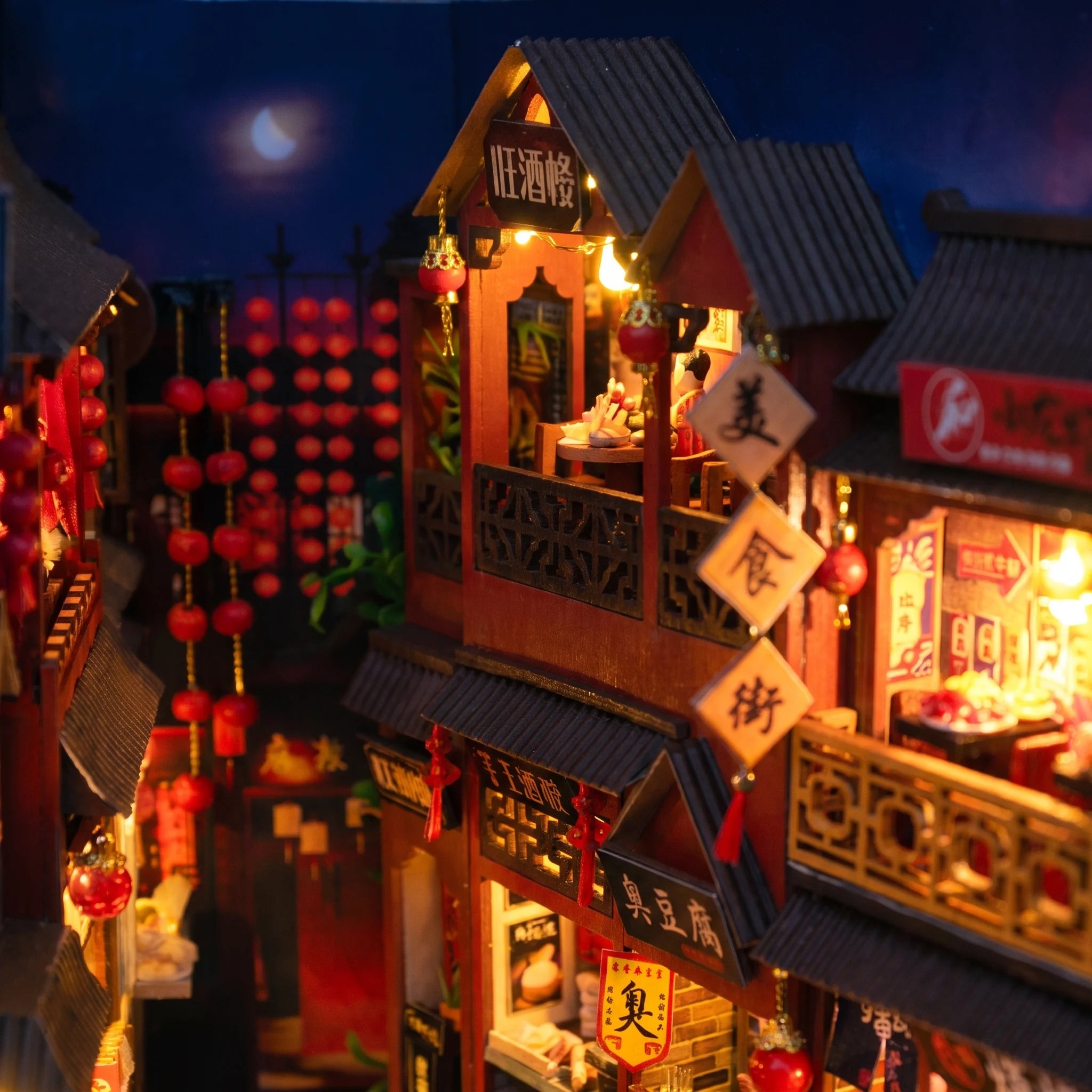 Detail of the tiled rooflines and moonlit sky inside The Night Market