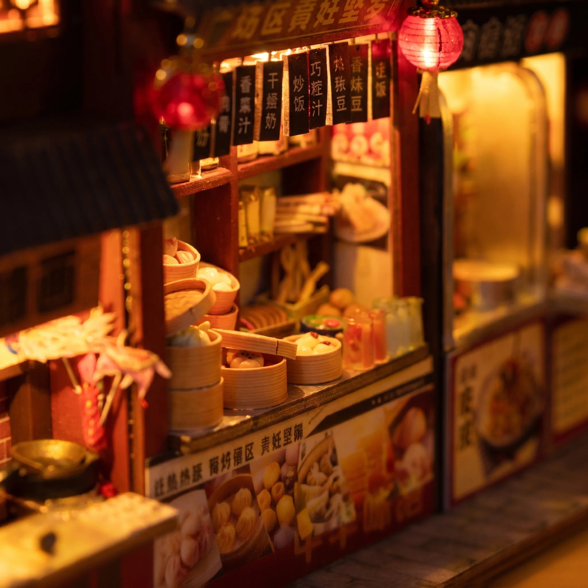 Detail of a glowing food stall with steamer baskets inside The Night Market