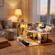 The Nordic Loft on a desk at dusk beside a mug of tea