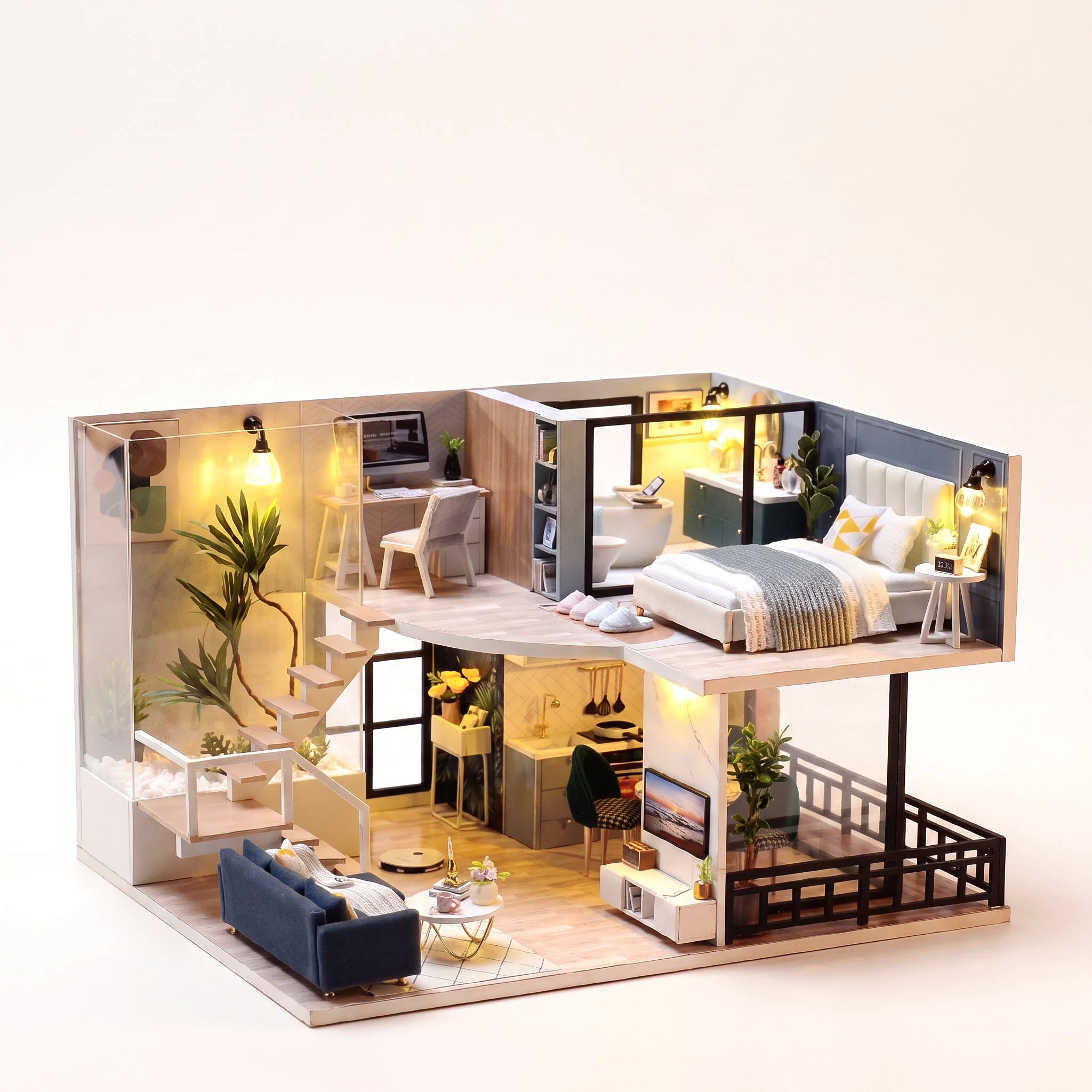 The Nordic Loft DIY miniature apartment kit, assembled with LED lights on