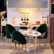 Dining nook detail: green velvet chairs, roses and the slate blue kitchen