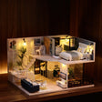 The Nordic Loft glowing on a walnut shelf at night
