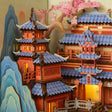 Macro of the vermillion pagoda towers and blossom branch
