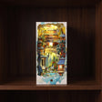 The Painted Peaks glowing on a walnut shelf at night