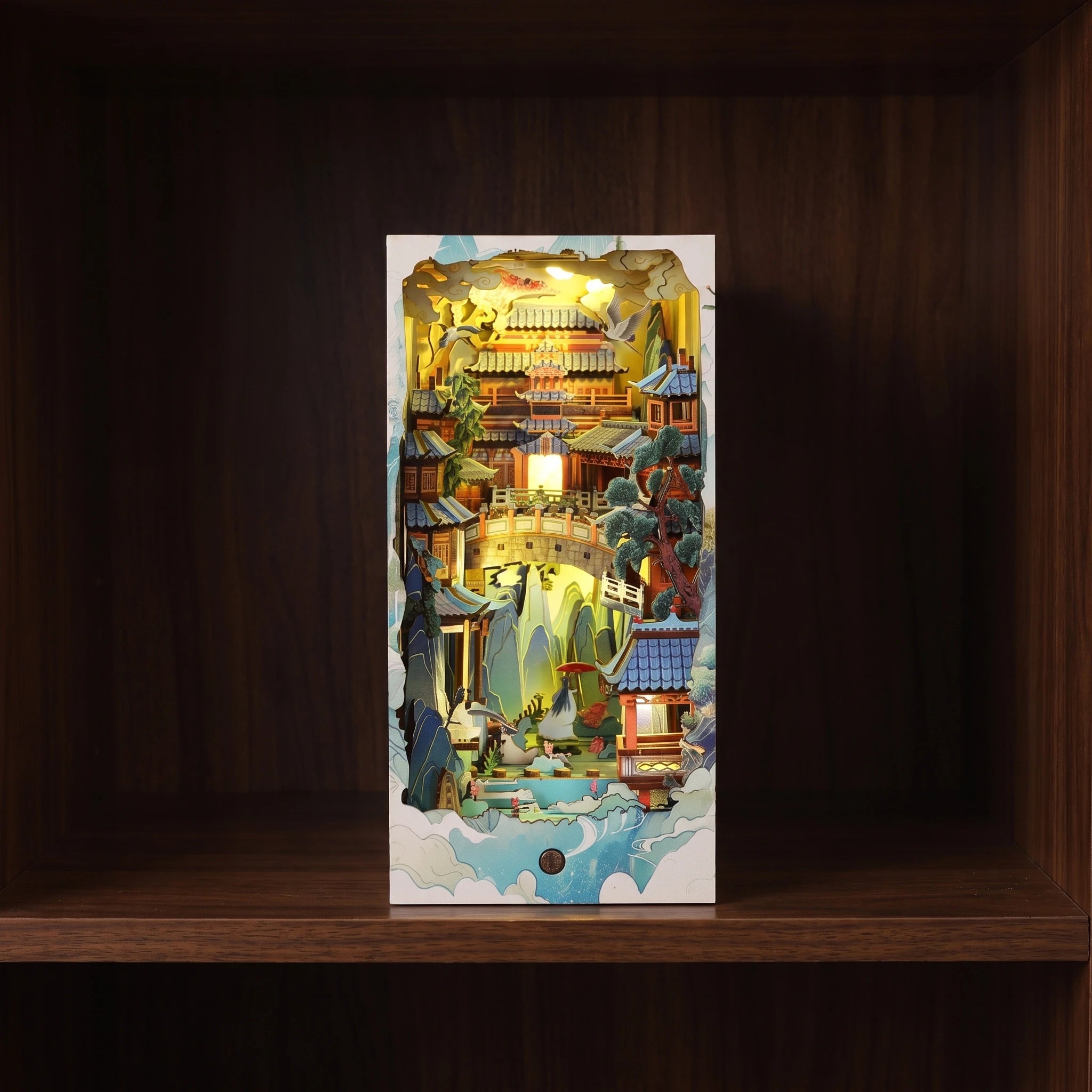 The Painted Peaks glowing on a walnut shelf at night