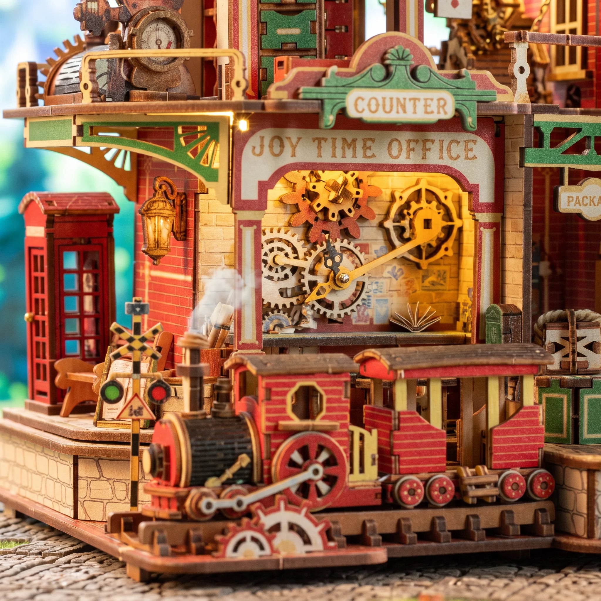 Macro of the Joy Time Office counter with gears, telephone box and steam train