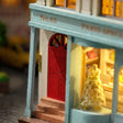 Macro of the red arched door at No.65 with brick steps