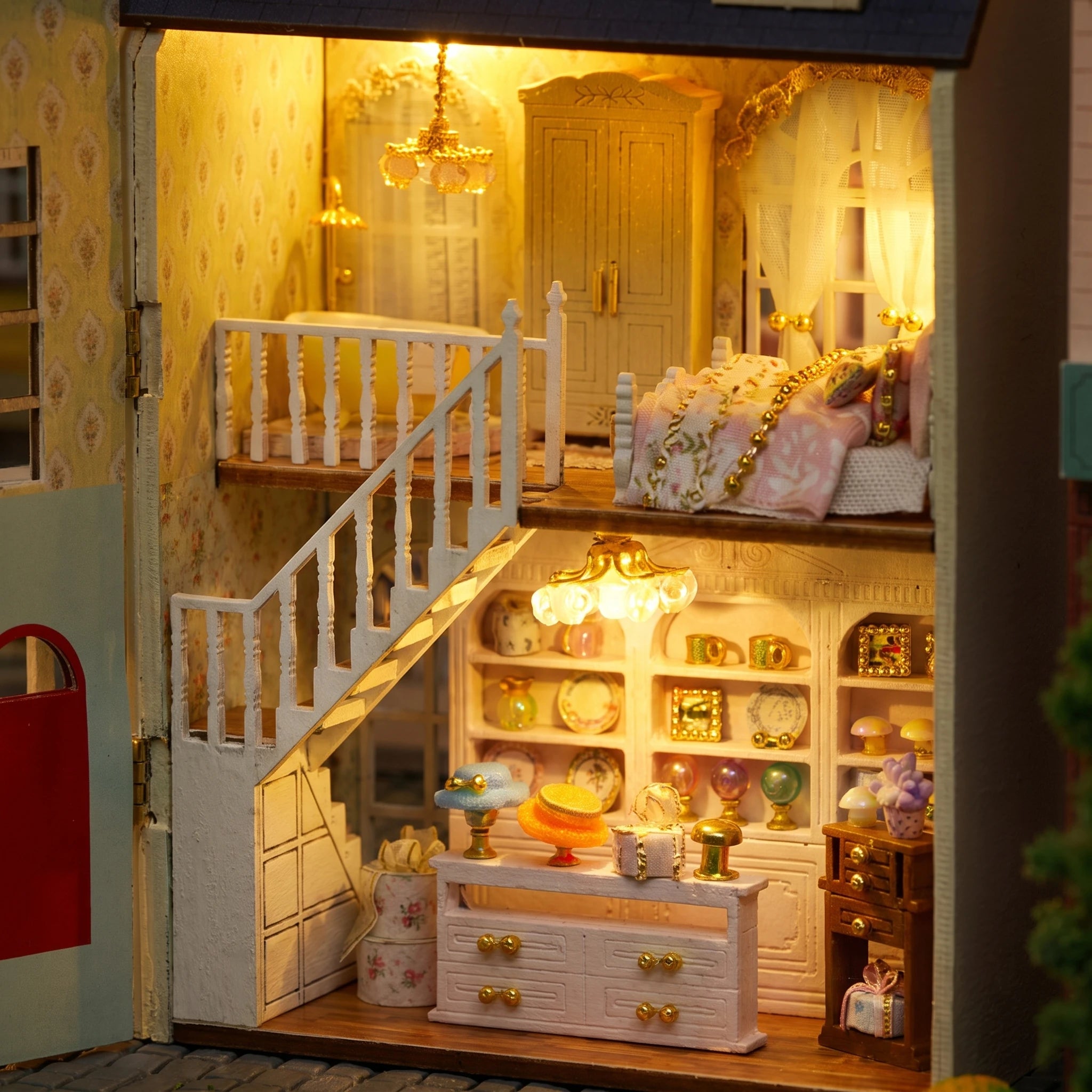 Macro of the open interior: upstairs bedroom, white staircase and boutique counter