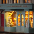 Macro of the boutique window with its gowned mannequin and gift shelves